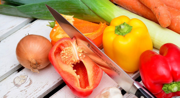 Knife cutting vegetables